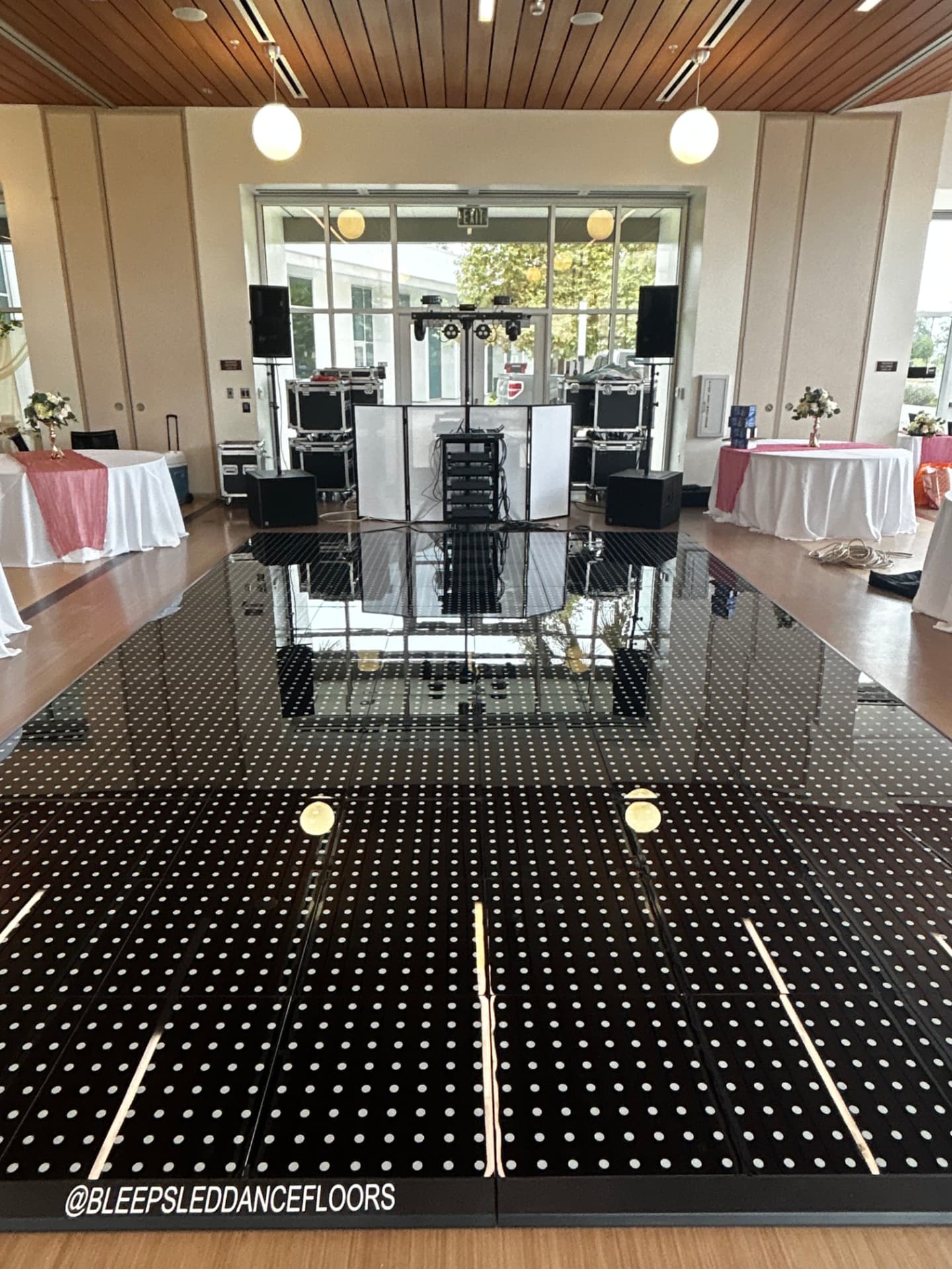 Bleeps Events DJ setup with speakers and lighting at an event venue